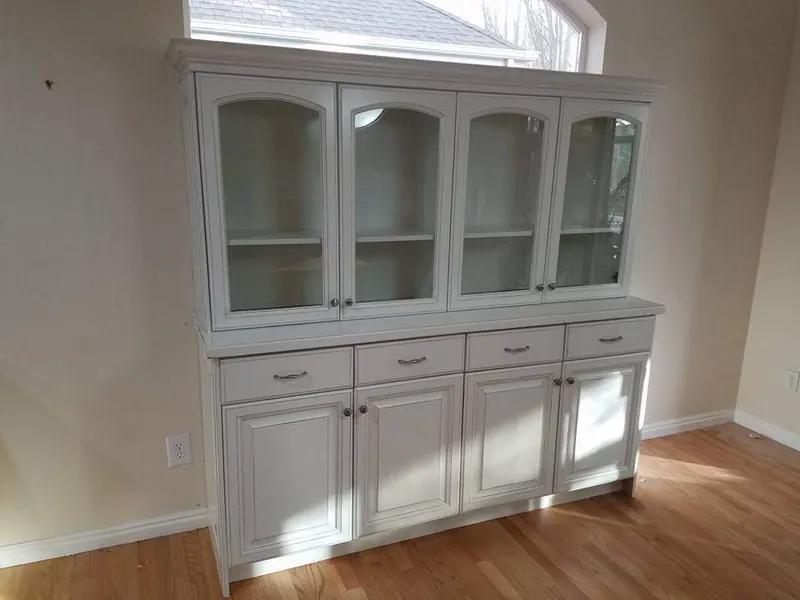 Refinished built-in hutch with glass-front upper doors