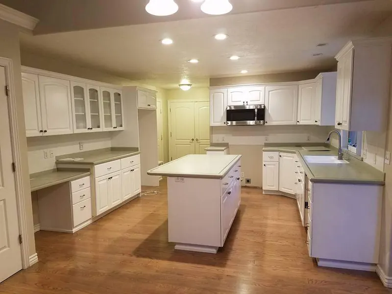 White painted kitchen with a center island